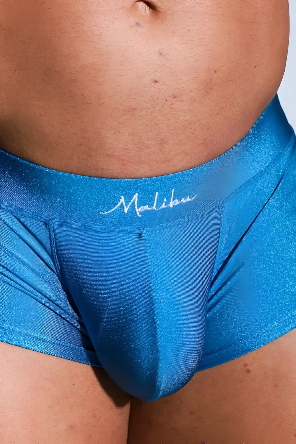 Dynamic sheen boxer briefs in cobalt blue feature shiny satin fabric with malibu embroidered on the waistband