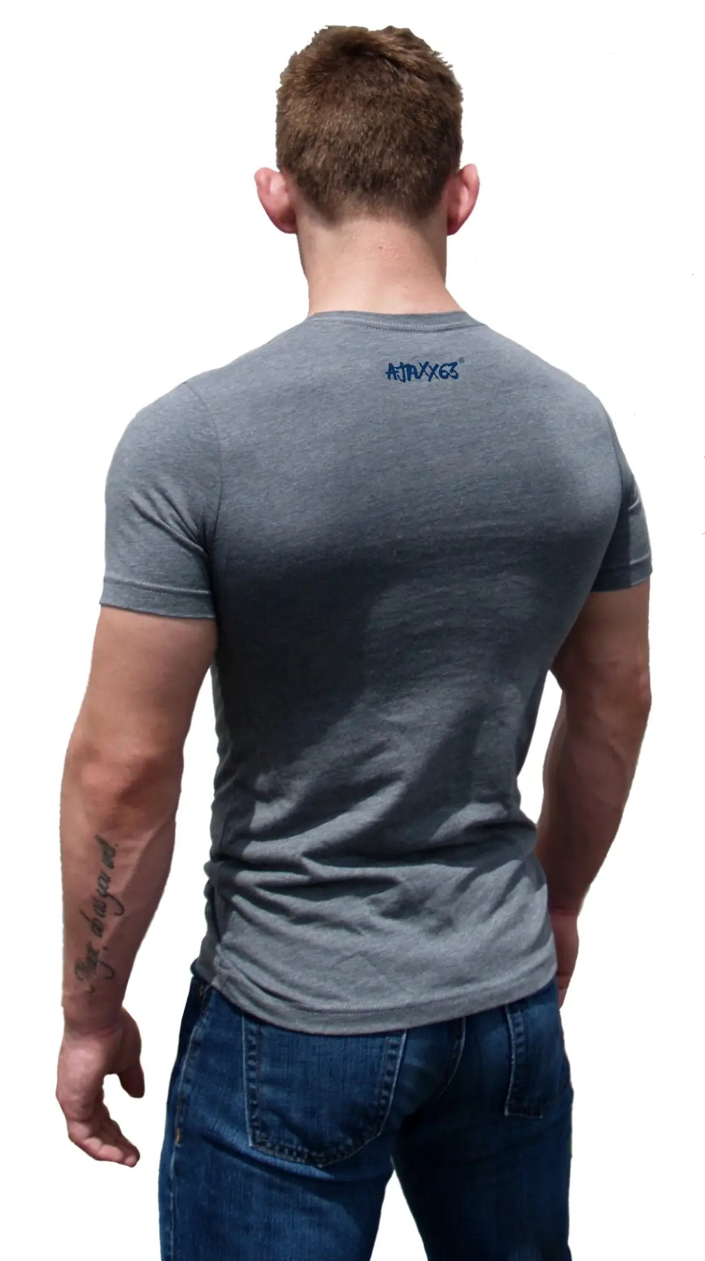 Back of a gray heathered cotton t-shirt with a small blue ntraves logo on the neckline premium heather easily corrupted