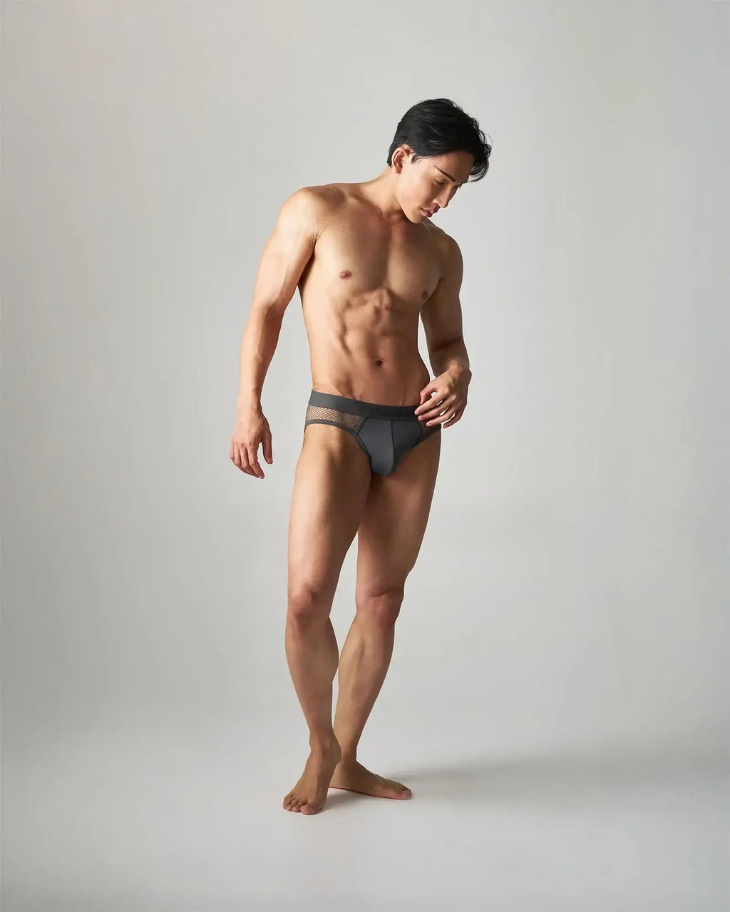 Dark gray edge net brief made of breathable mesh-trimmed fabric designed for comfortable all-day wear