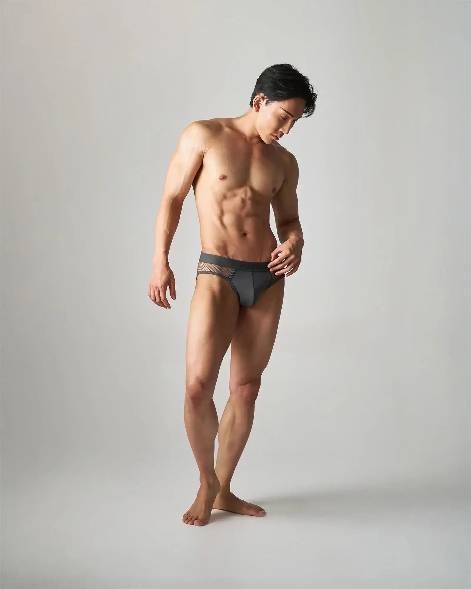 Dark gray edge net brief made of breathable mesh-trimmed fabric designed for comfortable all-day wear