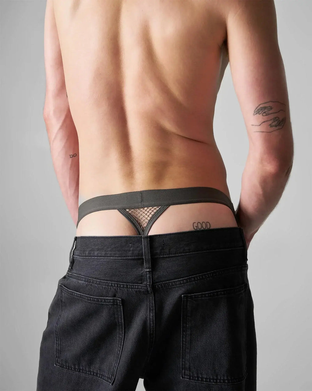 Black mesh thong with solid waistband and good embroidery on the right side from edge net jock thong collection