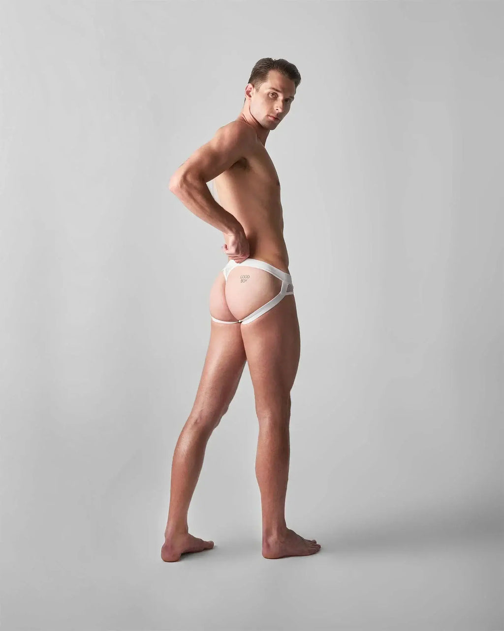 White lace-trimmed briefs with minimalist design and subtle branding on front from edge net jock thong collection