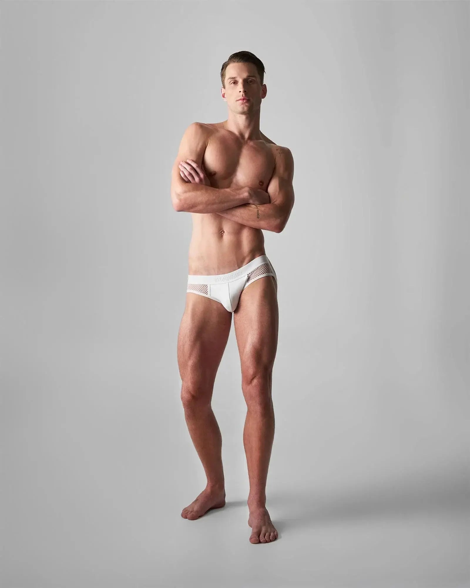 White mesh-trimmed briefs from edge net jock thong showcasing lightweight breathable fabric and sporty design