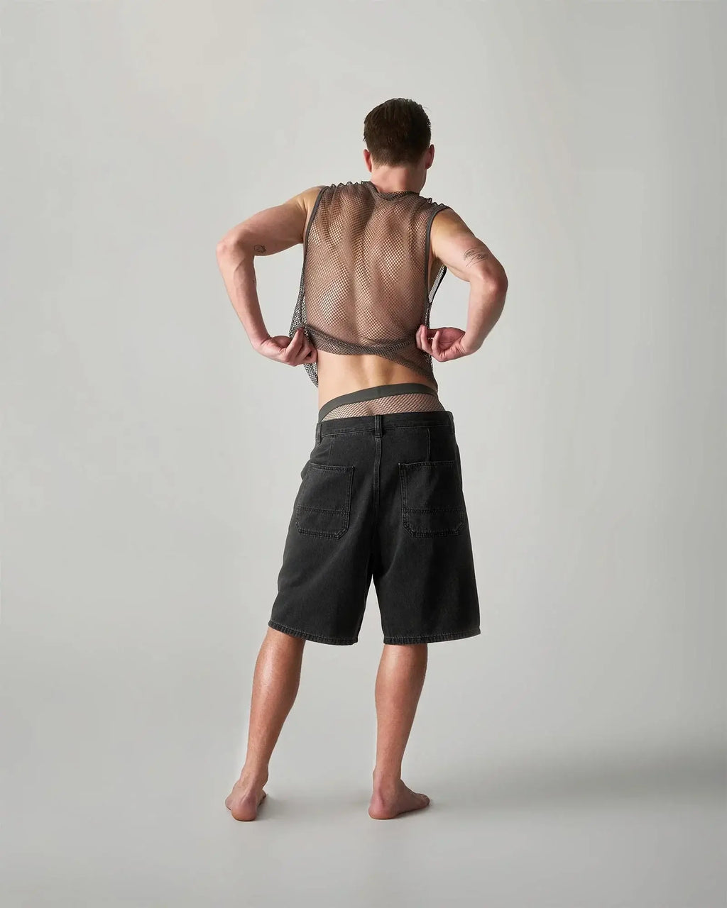 Black edge net mesh muscle tank with adjustable straps and sheer semi transparent mesh fabric design