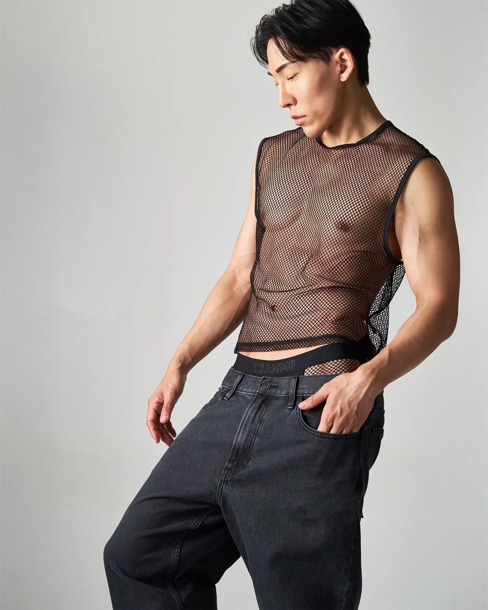 Black mesh sleeveless edge net mesh muscle tank with fitted semi-transparent design for casual wear