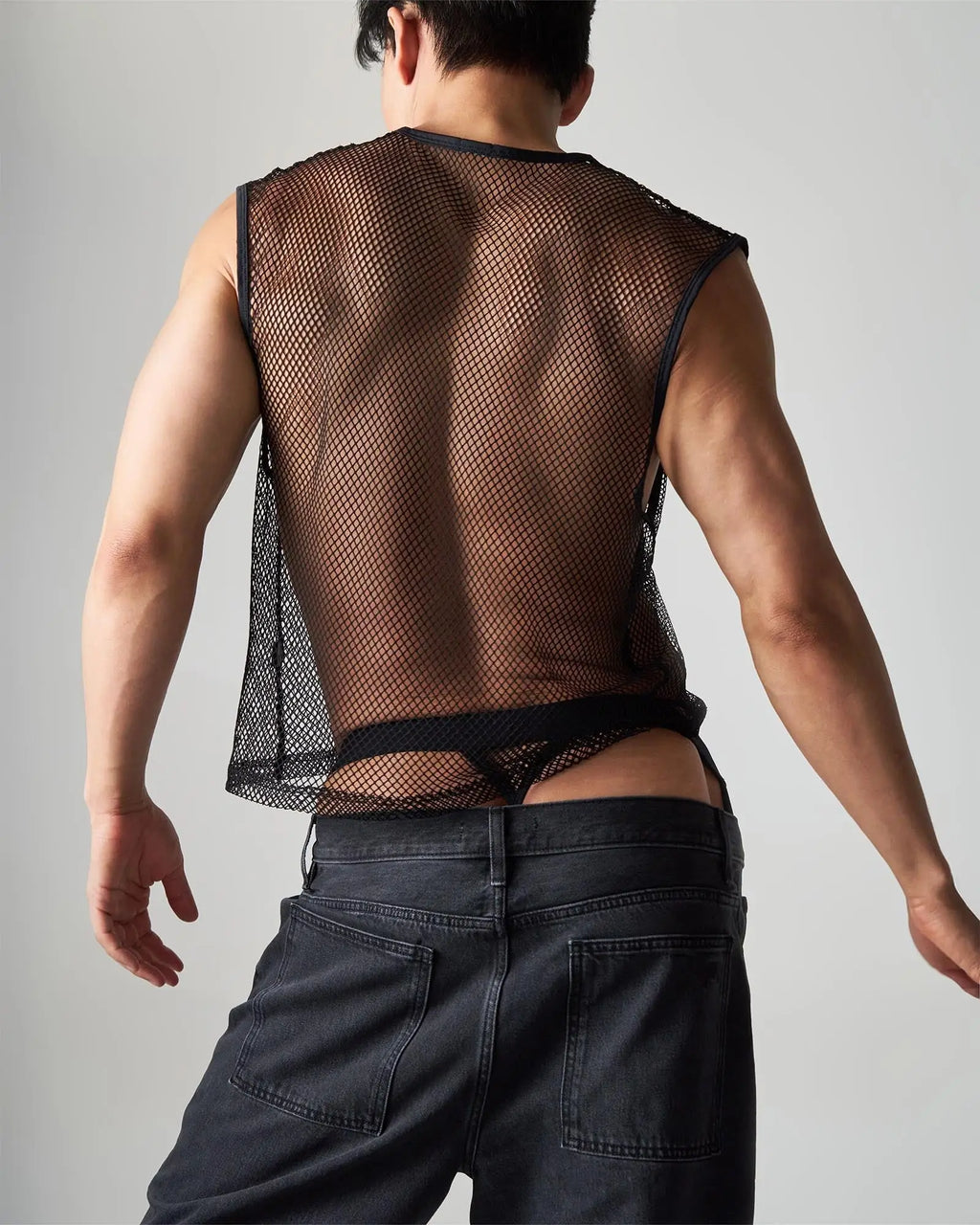 Black mesh sleeveless edge net mesh muscle tank with sheer breathable fabric and a fitted cut