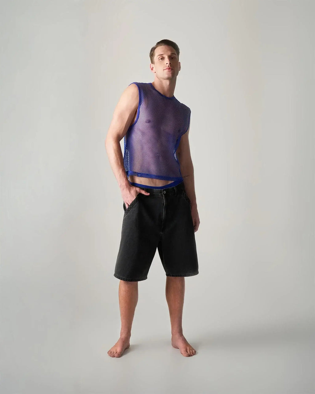 Purple mesh sleeveless edge net mesh muscle tank with blue trim designed for breathable athletic wear