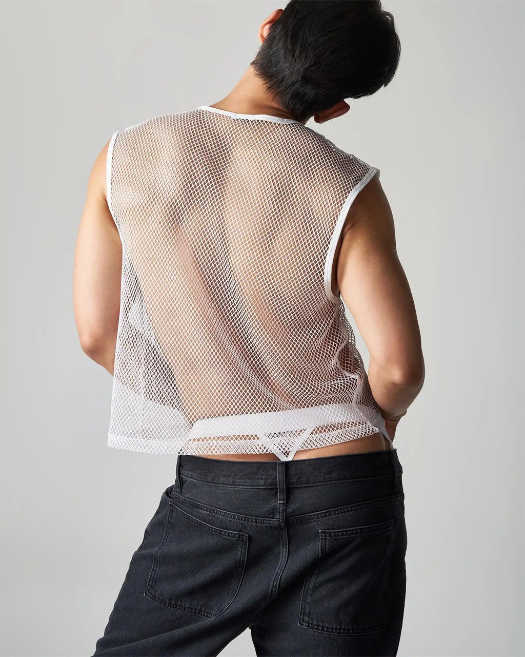 White mesh sleeveless edge net mesh muscle tank with fitted cropped design and lace trim at hem