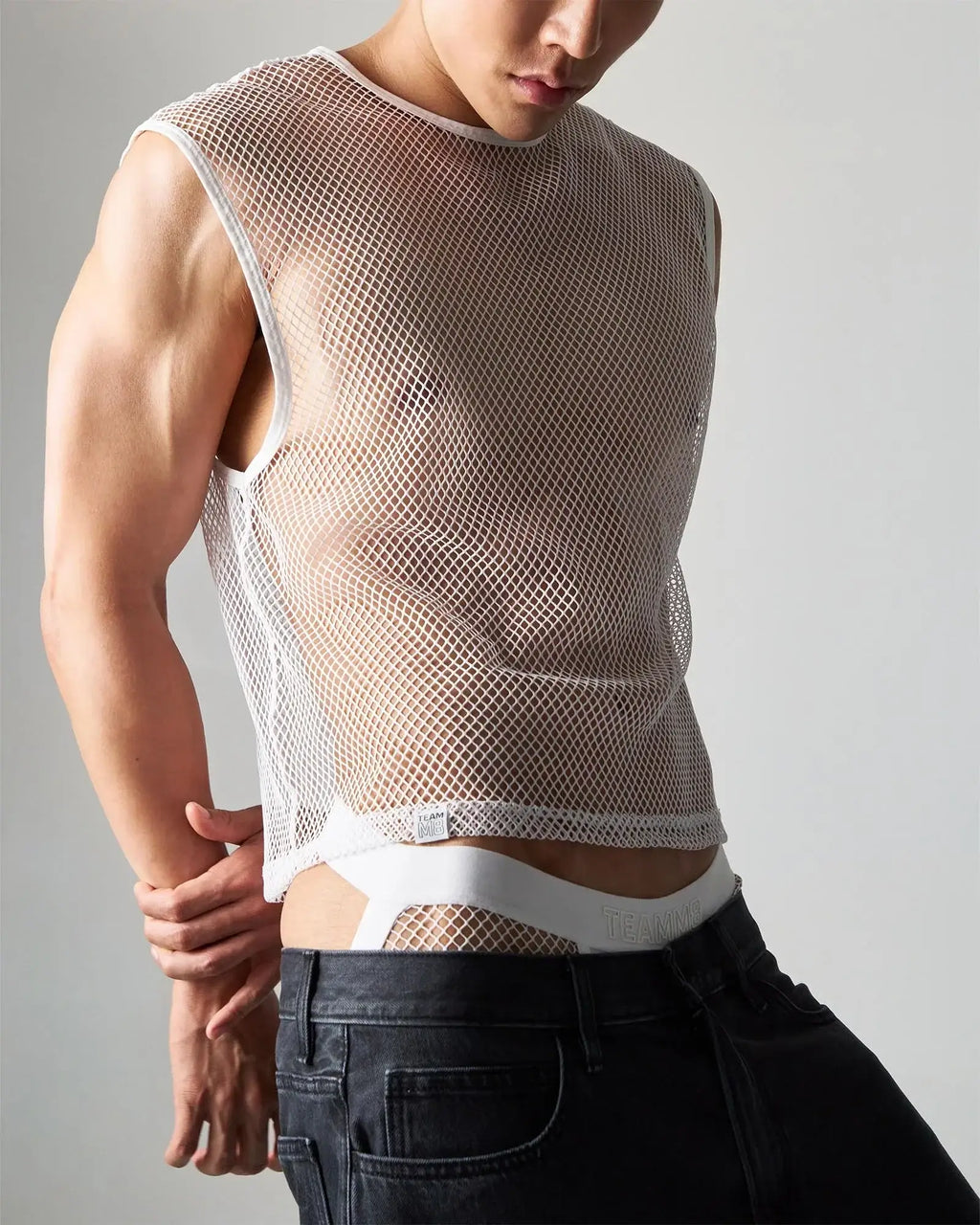 White edge net mesh muscle tank sleeveless top with rounded neckline and elasticated hem