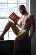 Yellow adonis branded electric yellow jockstrap briefs with white trim and black lettering front view
