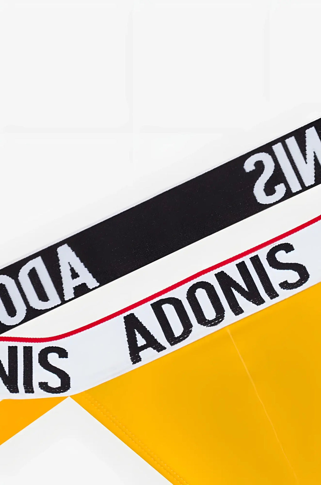 Electric yellow jockstrap with black and white striped waistband featuring bold adonis lettering and a thin red edge line