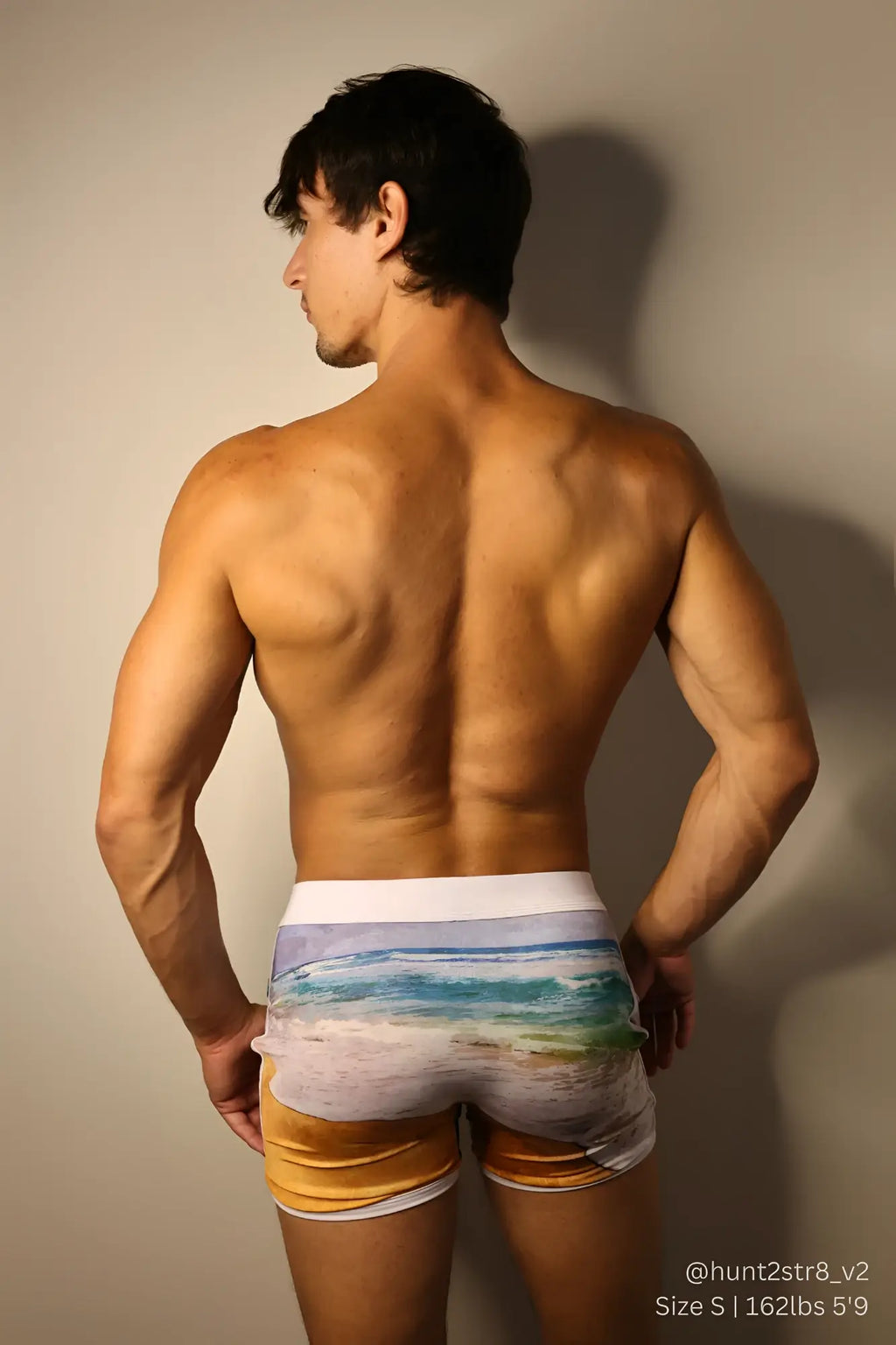 Elevate comfort 4 inch men’s beach-themed swim trunks with ocean sand print white waistband and gold trim