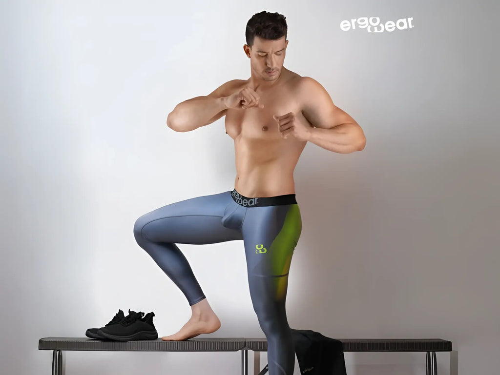 A pair of ergo wear ew1604 max se men’s ergonomic leggings in gradient blue and green with logo waistband