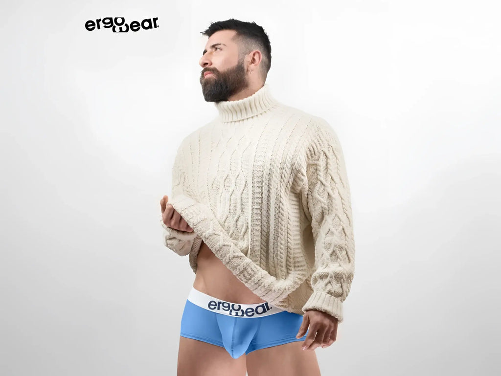 Cream-colored cable knit turtleneck sweater from ergowear paired with light blue max cotton trunks