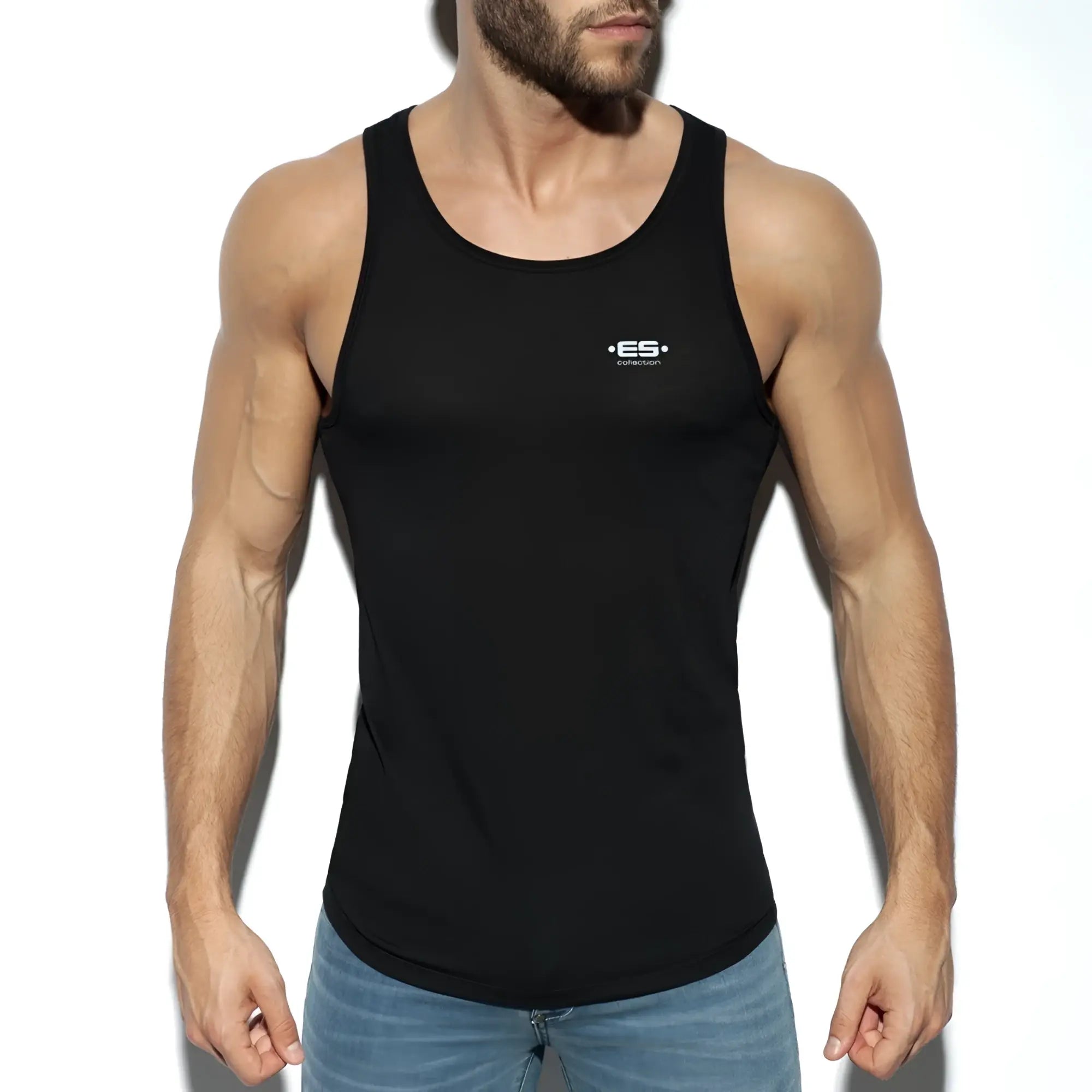Black es basic tank top with subtle white logo on chest made of soft breathable fabric
