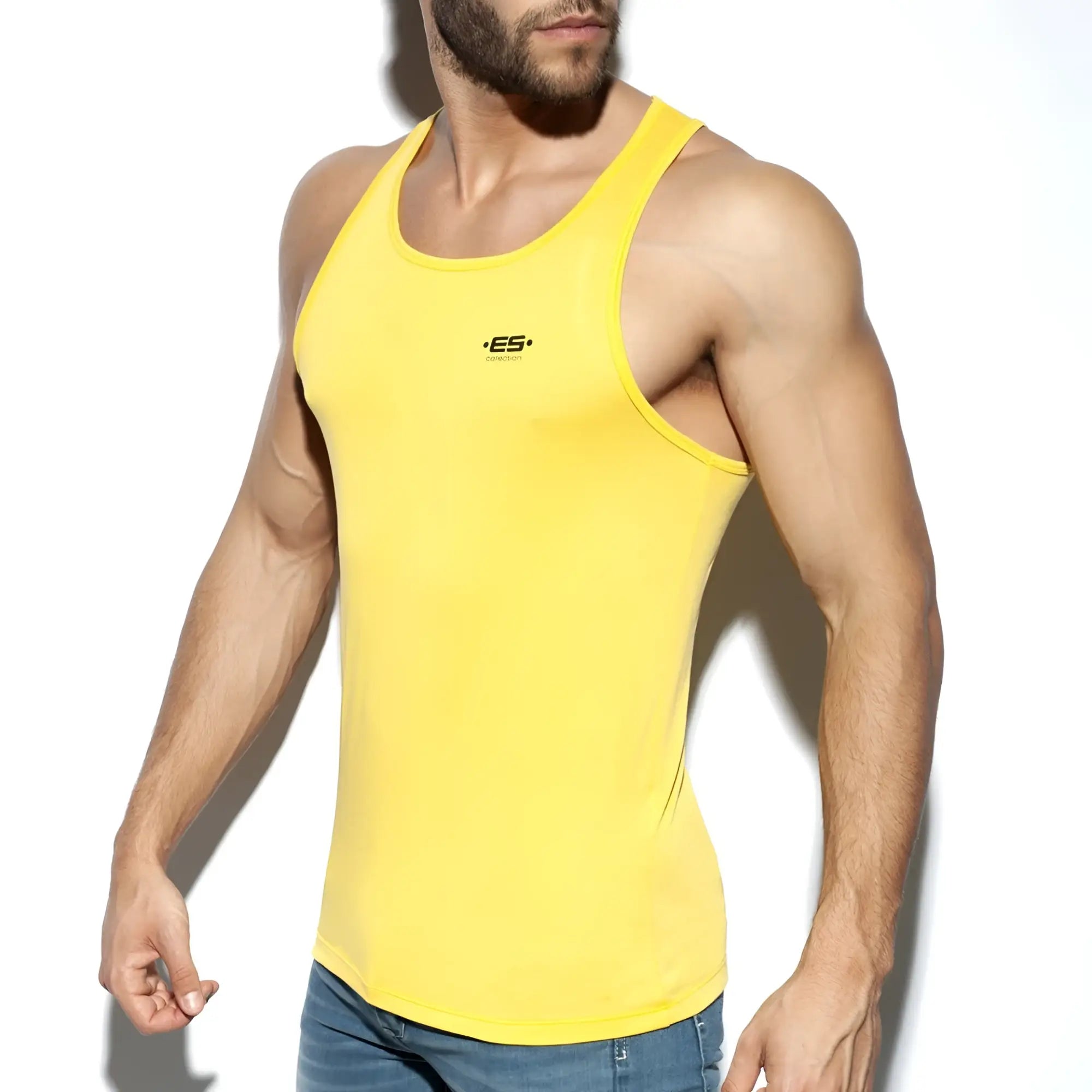 Bright yellow es basic tank form-fitting tank top with small black logo on the chest for casual wear