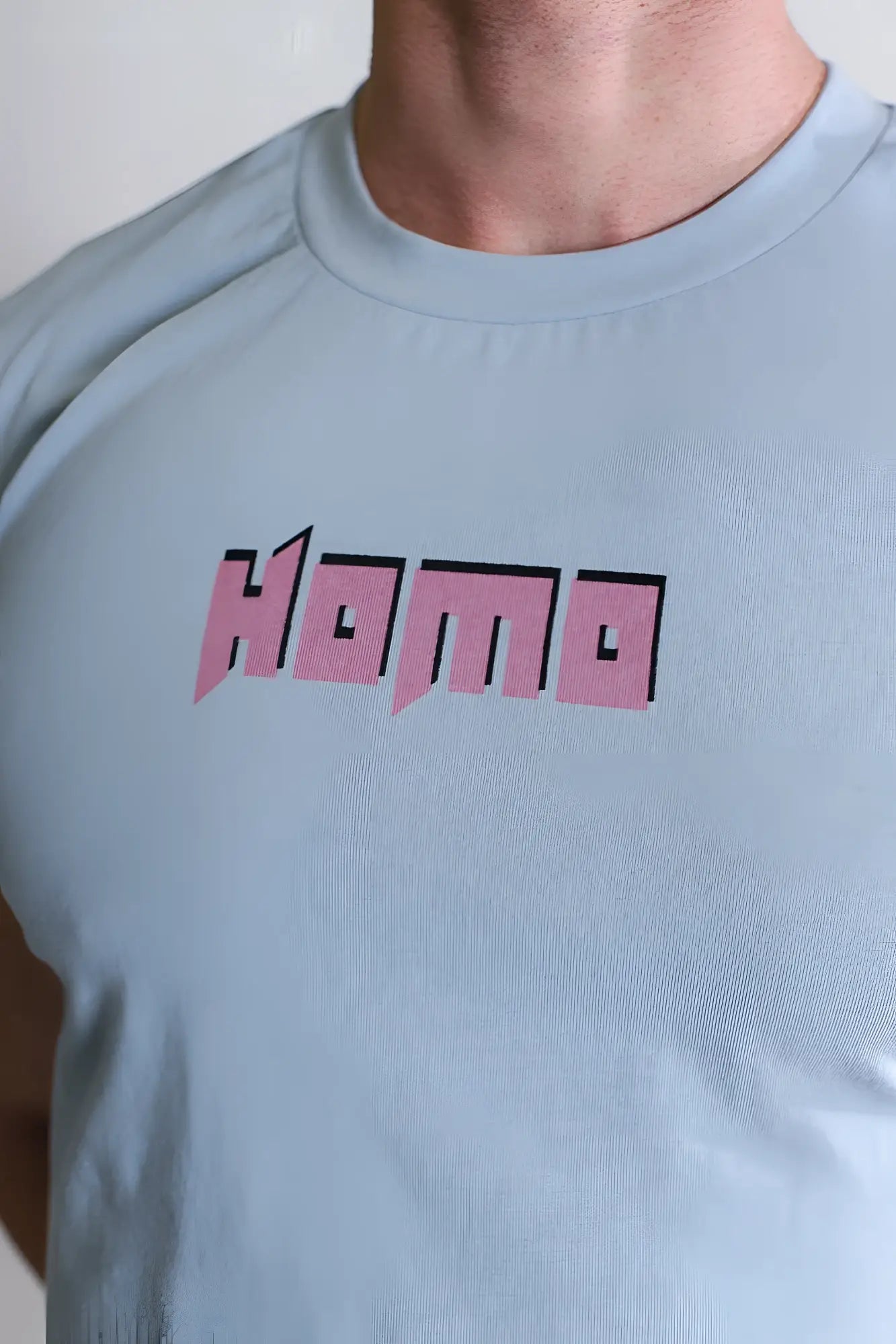 Light blue crew neck t-shirt with bold pink and black homa graphic printed for a muscle fit crop tank style