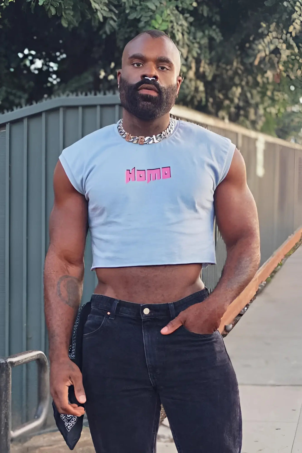 Light blue muscle-fit cropped sleeveless t-shirt with pink homo lettering in escapism crop tank style