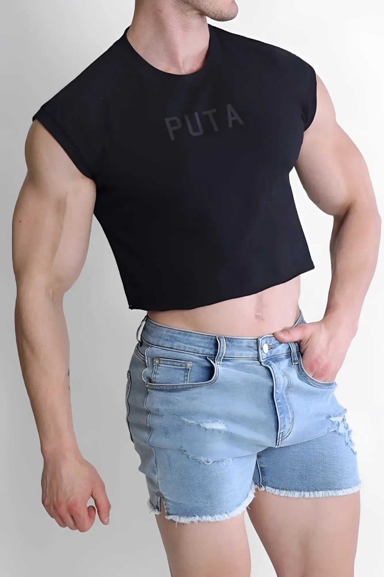 Black sleeveless muscle-fit crop tank top with puta printed in faded gray across the chest for casual wear