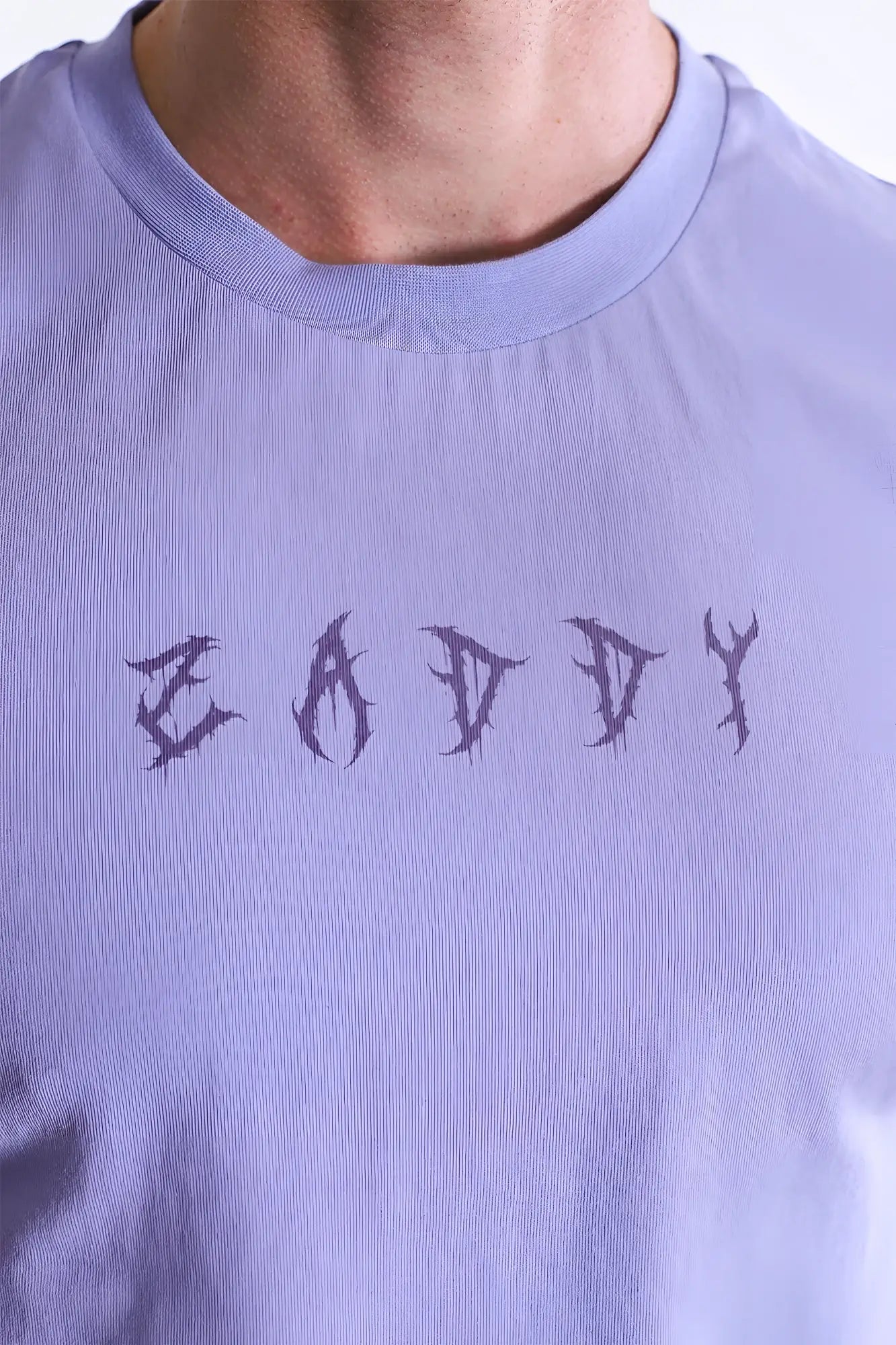 Lavender cotton escapism muscle-fit crop tank with dark stylized eady graphic printed across the chest