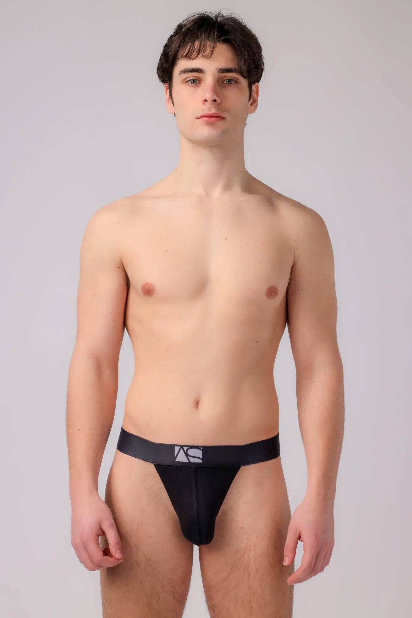 Black athletic thong briefs with sleek form-fitting design and subtle logo on waistband by AS Exclusive