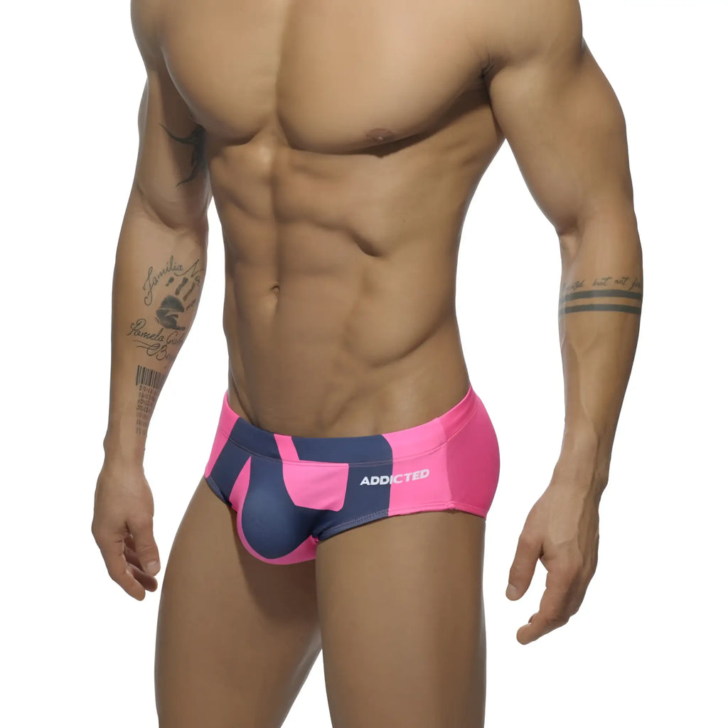 Extra-large logo brief bright pink and navy blue patterned swim trunks with addicted brand name on the side