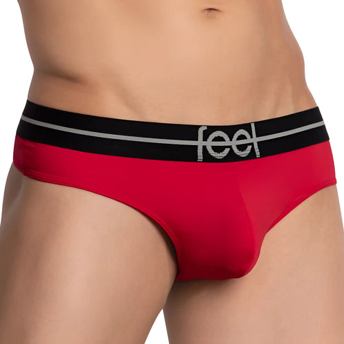 Red men’s briefs with a black waistband featuring the feel logo in silver lettering for comfortable everyday wear