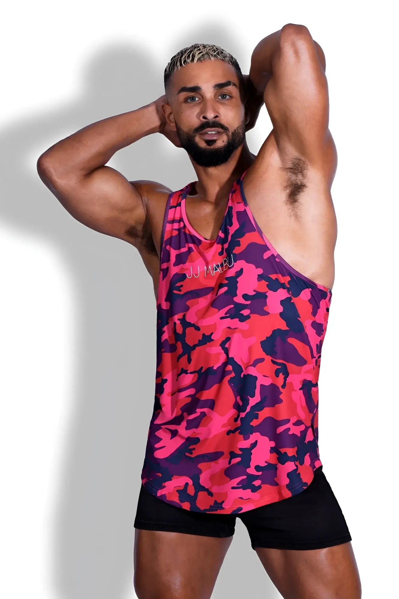 Feel-me scoop bottom tank purple camo is a vibrant pink and purple camouflage v-neckline tank top perfect for casual wear