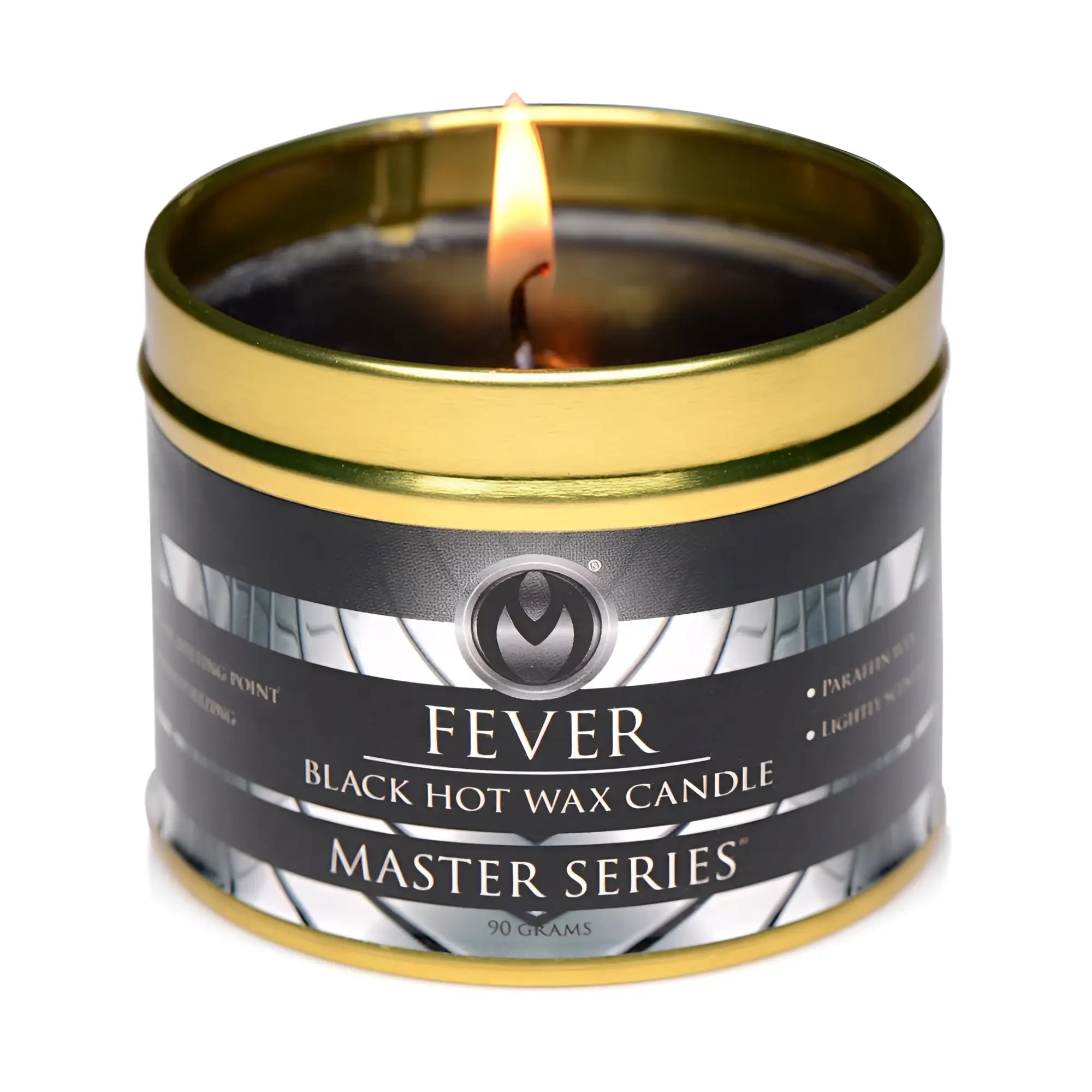 A lit black hot wax candle in a gold-toned metal tin labeled fever from the master series for relaxation