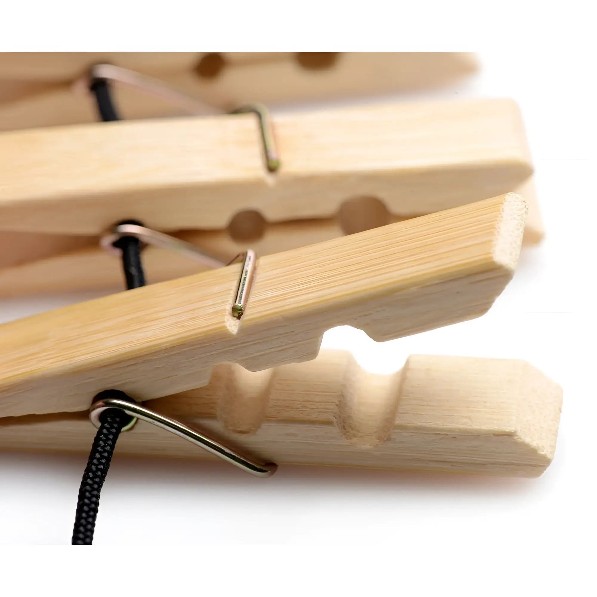 Light-colored wooden firecracker clothespin body zipper with metal springs and black braided cords