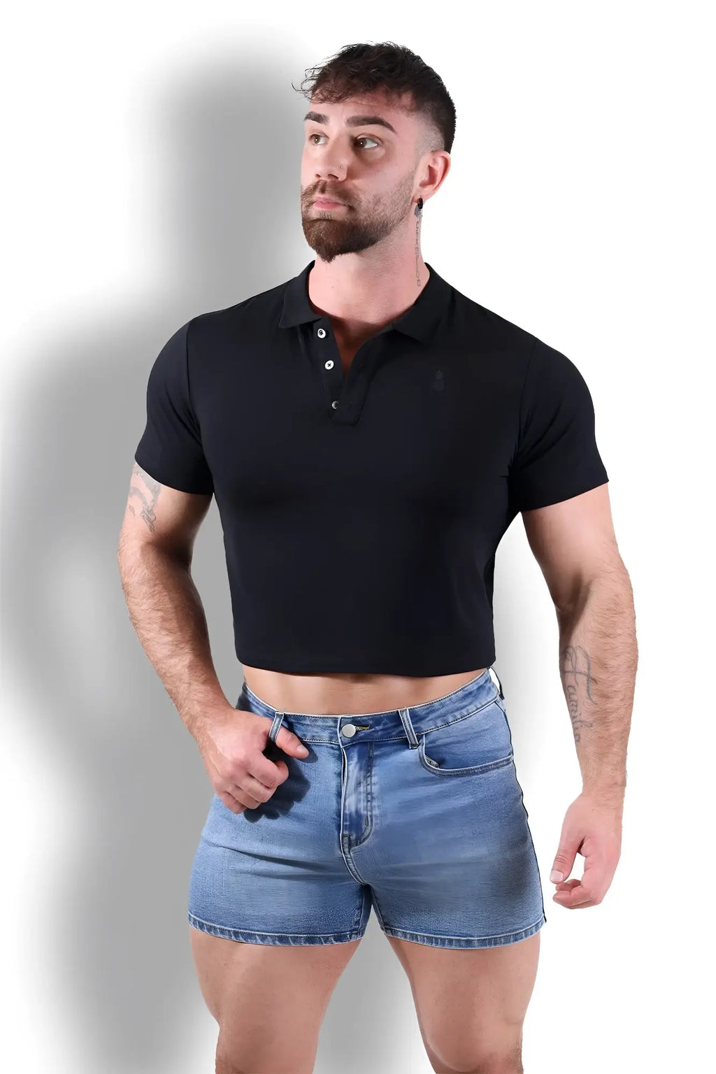 Fitted polo crop top black featuring a short sleeve cropped design with buttoned collar in soft fabric