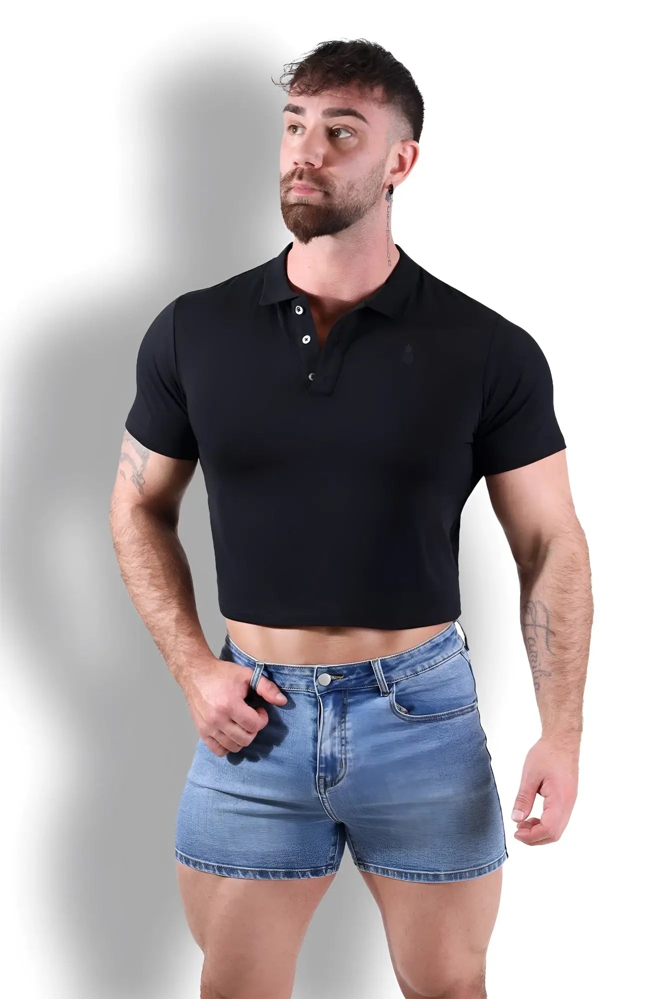 Fitted polo crop top black featuring a short sleeve cropped design with buttoned collar in soft fabric