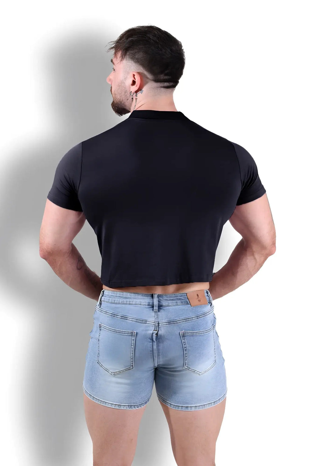 Black fitted polo crop top with short sleeves and high collar in soft cotton blend perfect for casual wear