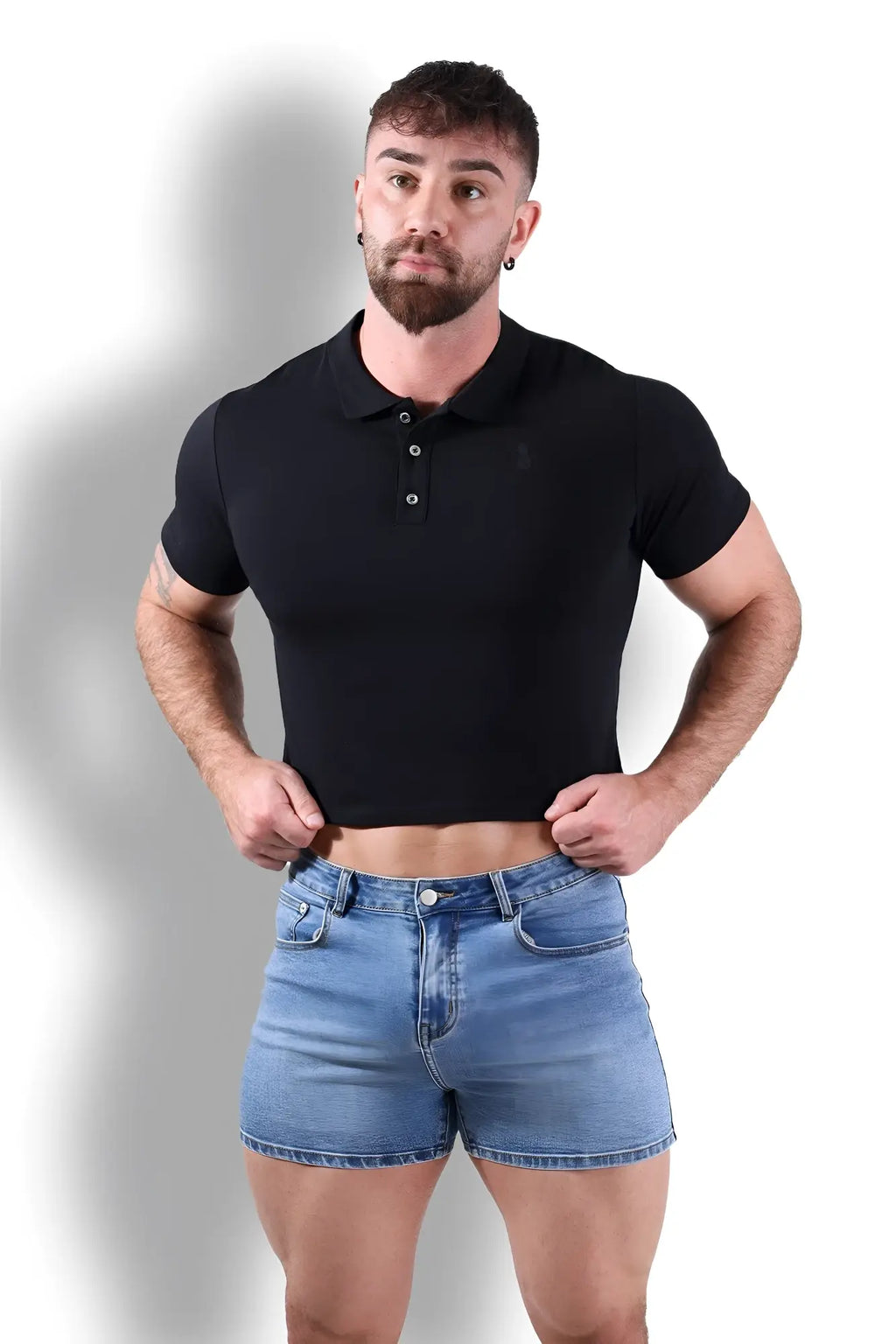 Fitted polo crop top in black with short sleeves, collar, and button placket made from soft fabric for casual wear