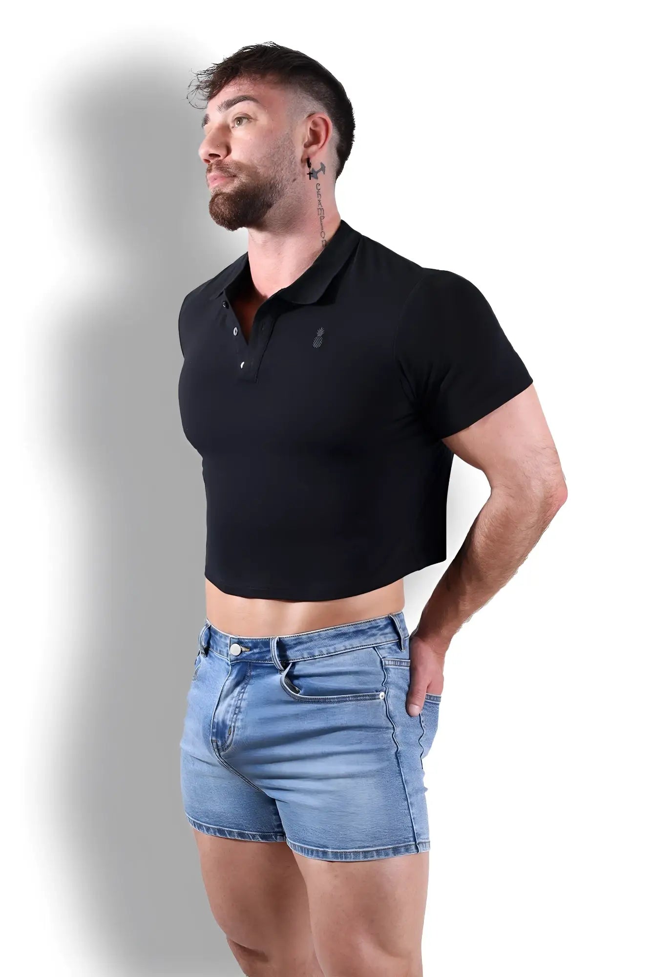 Black fitted polo crop top with short sleeves made from soft fabric featuring a small embroidered chest logo