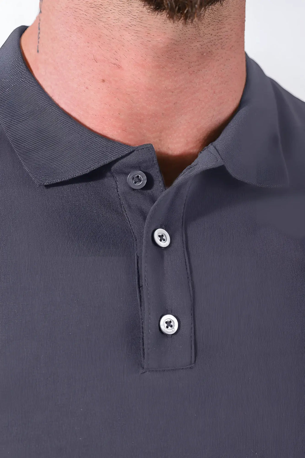 Fitted polo crop top in dark grey with ribbed collar and three silver toned buttons
