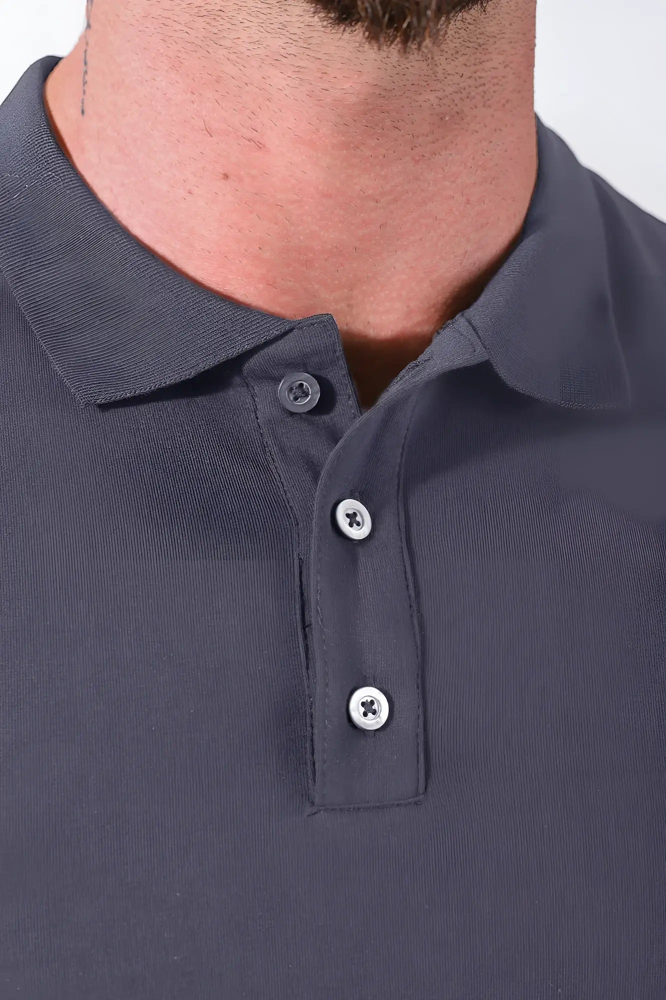 Fitted polo crop top in dark grey with ribbed collar and three silver toned buttons