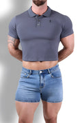 A fitted dark grey short-sleeved polo crop top with a classic collar and button placket