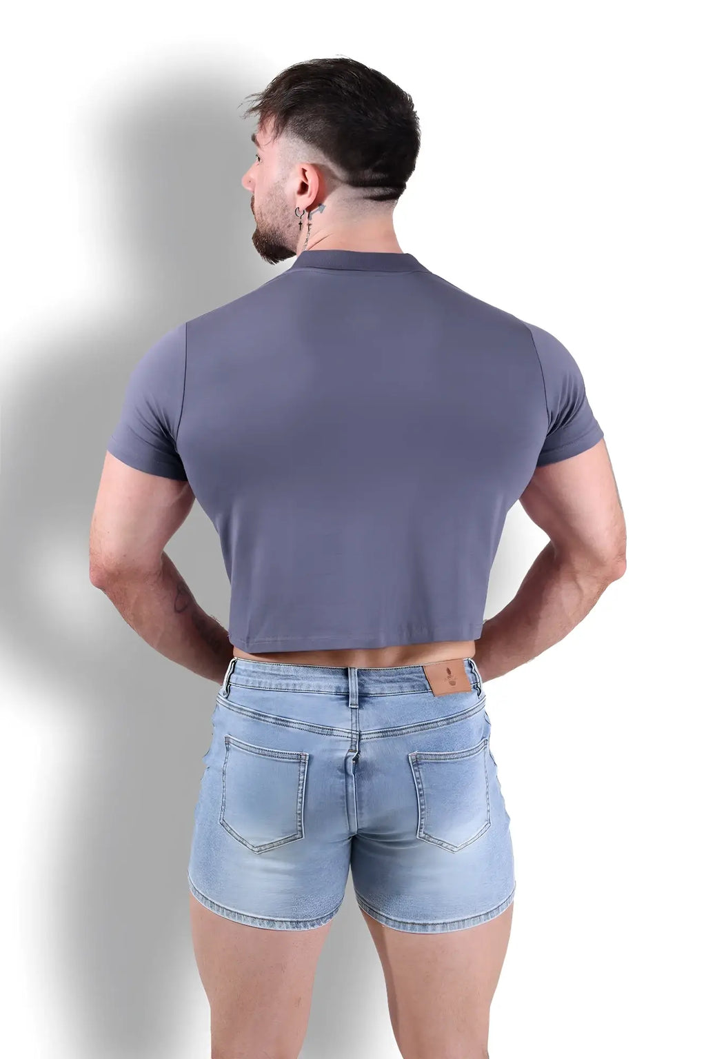 A fitted polo crop top in dark grey made from stretchy fabric with short sleeves for a sleek look