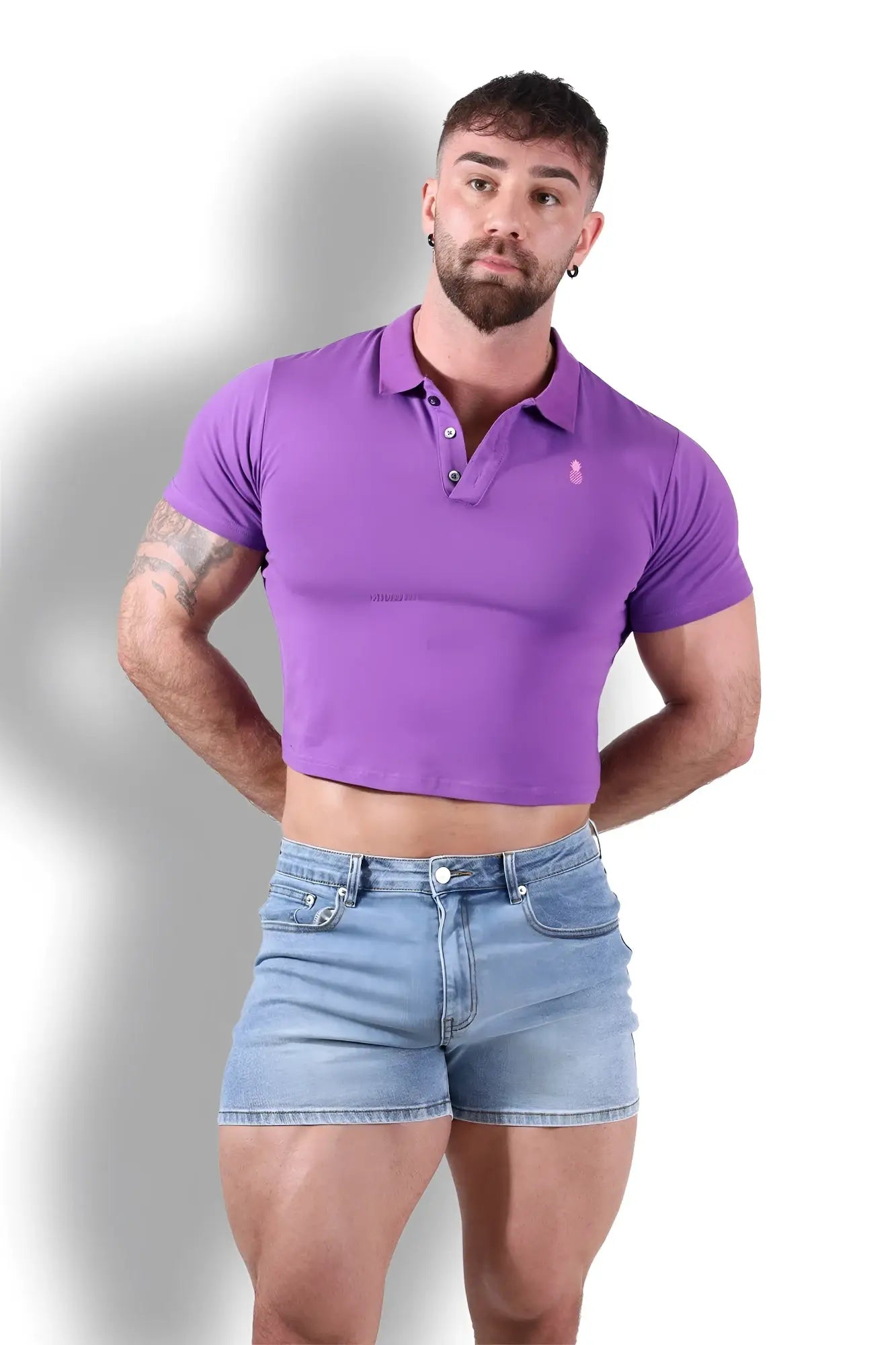 Purple fitted polo crop top with a small embroidered logo on the left chest for casual wear