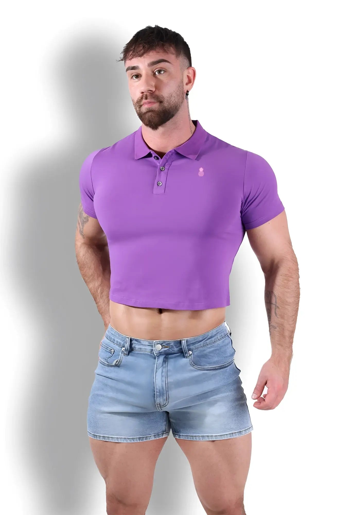 Fitted polo crop top in purple with a small embroidered logo on the chest made from soft material