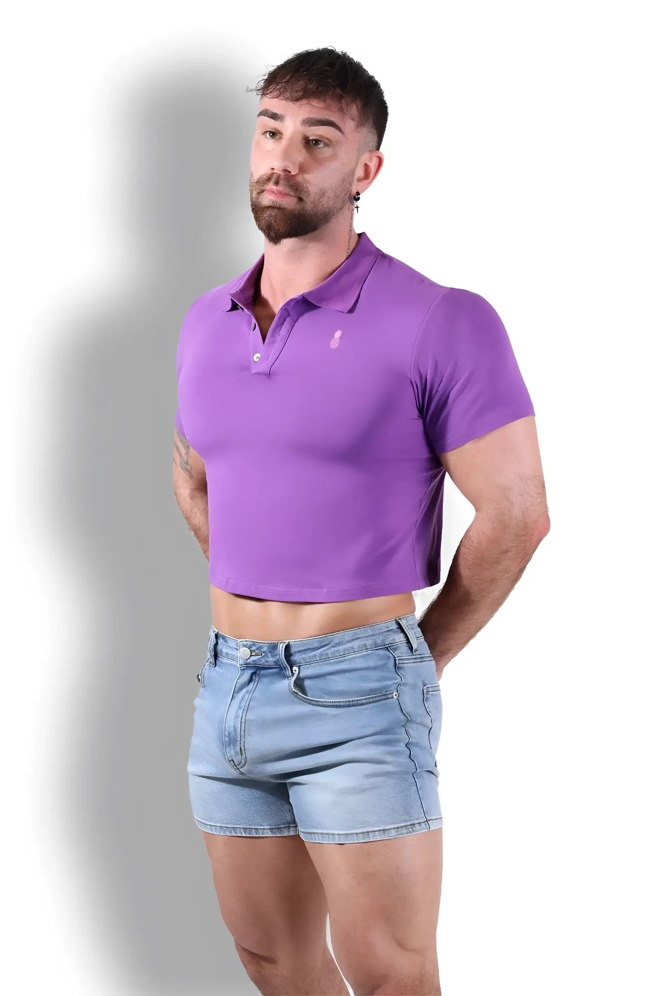 Fitted polo crop top purple with a small pink logo on the chest made from soft breathable fabric