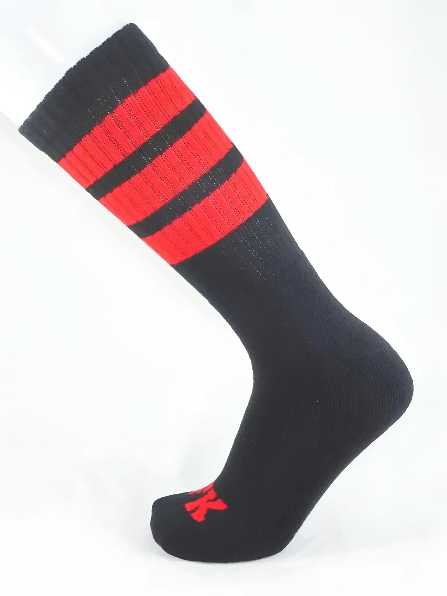 Fk sport black tube sock featuring bold red stripes and a small red logo on the toe in athletic design