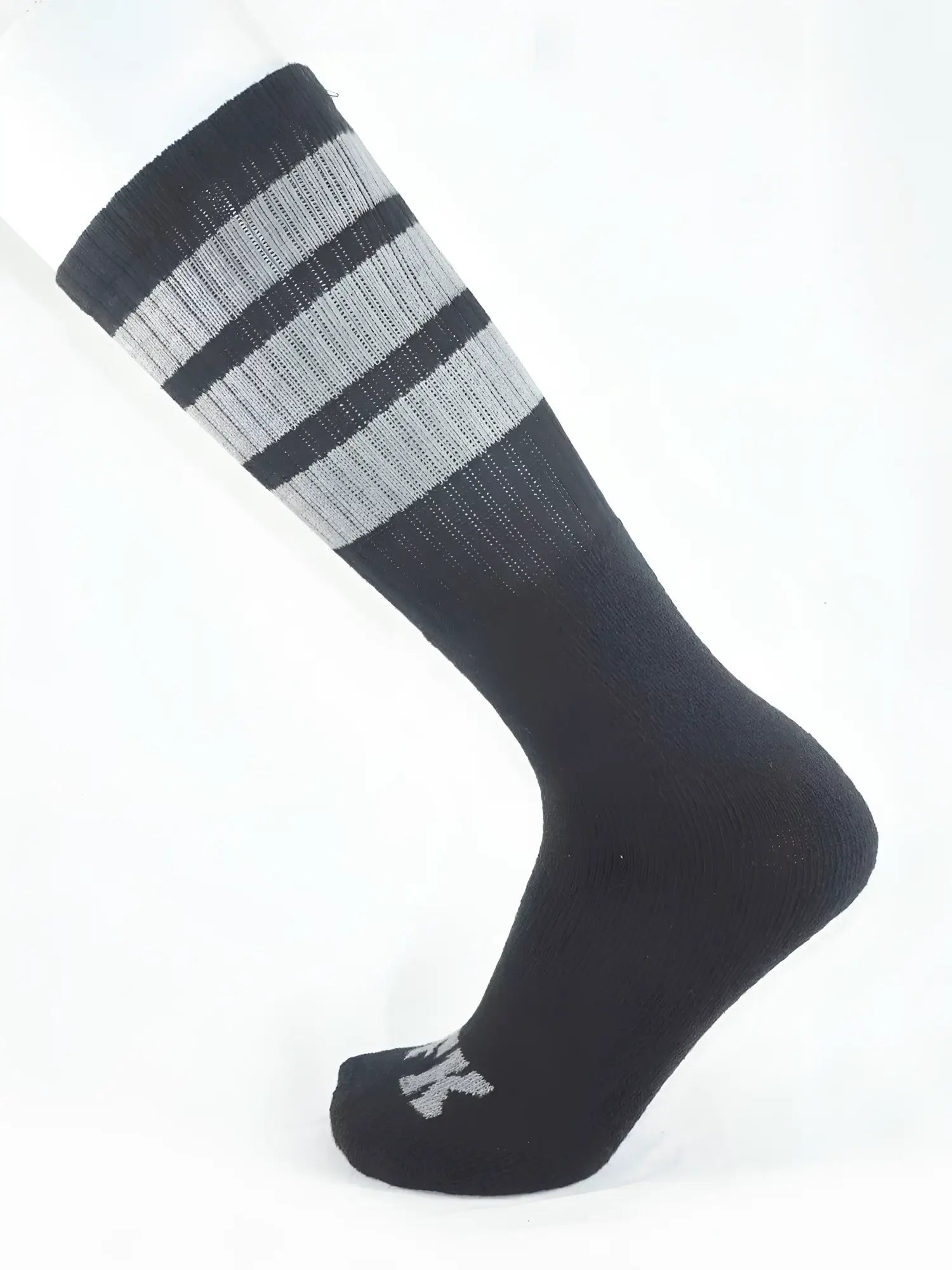 Fk sport black tube sock with ribbed texture and three horizontal stripes at the top cuff