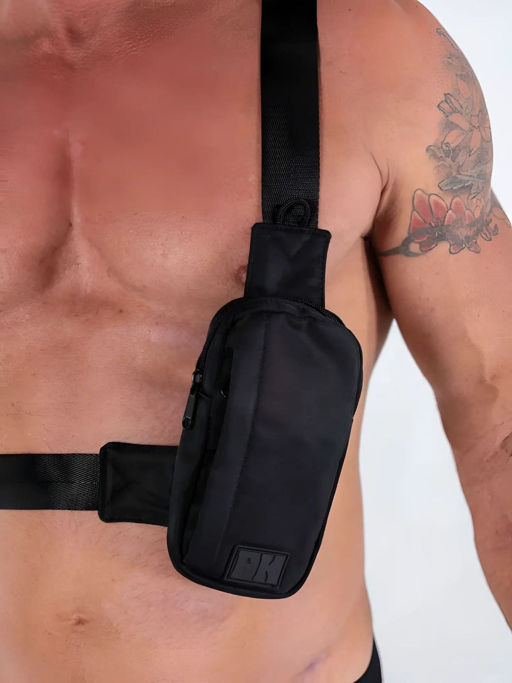 Fk Sport cross body bag black nylon pouch with subtle texture and small rectangular logo patch on lower front