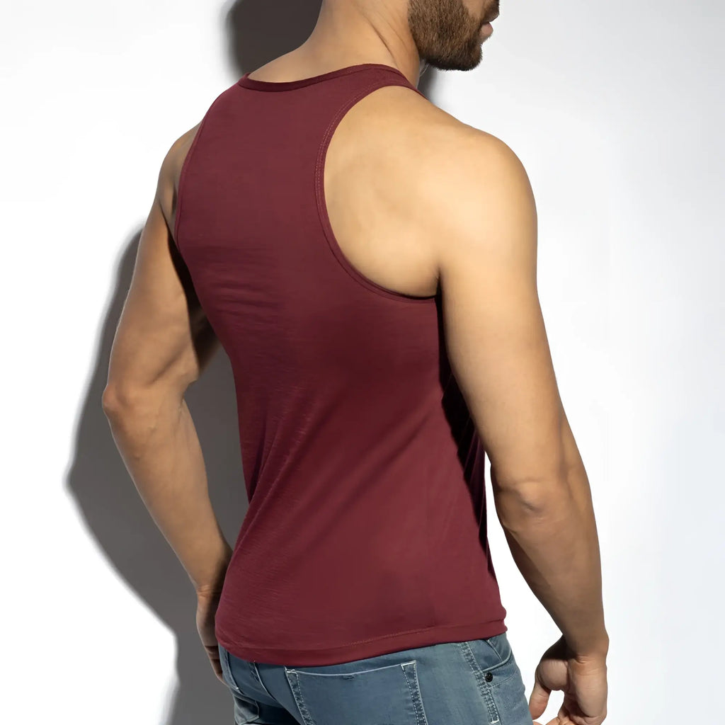 A maroon sleeveless flame tank top with a round neckline and ribbed hem for casual wear