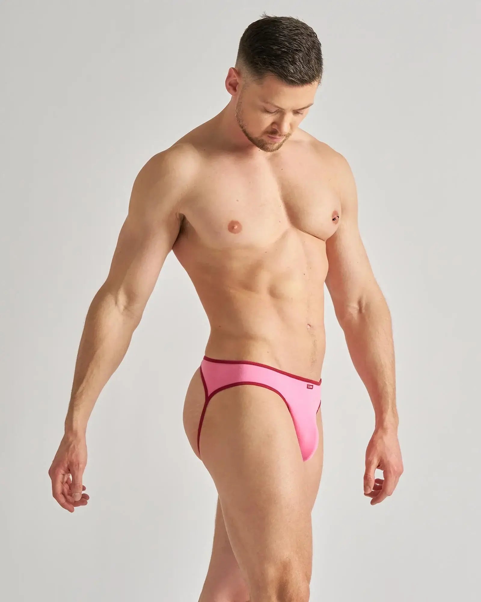 Fluent jockstrap bright pink form-fitting briefs with dark red trim designed for bold comfortable wear