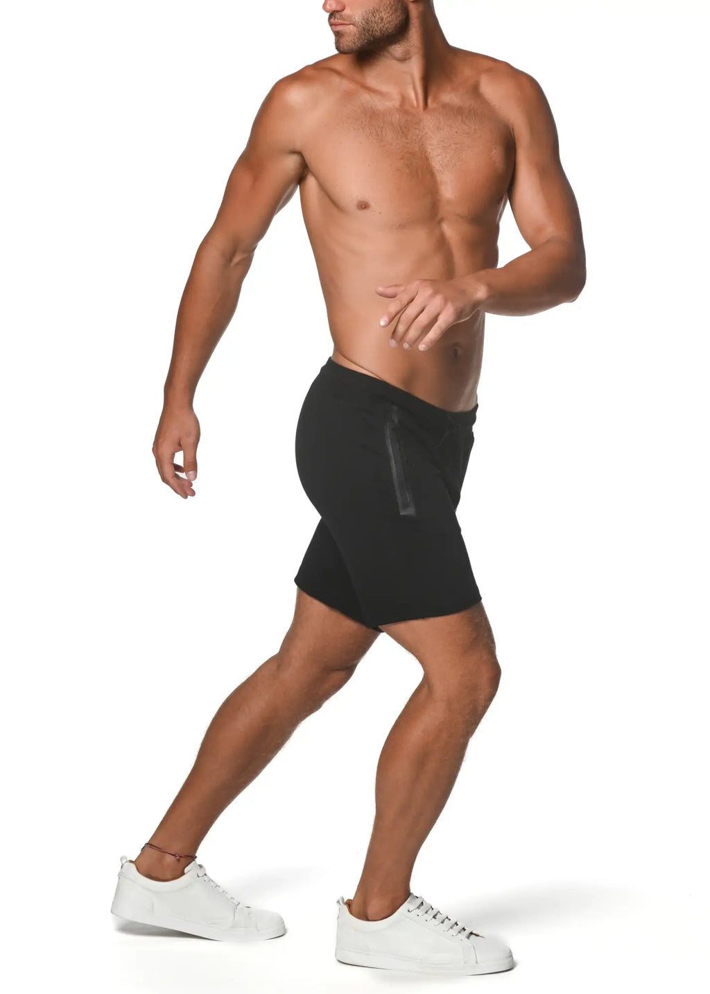 Black fleece flex-cotton stretch shorts with subtle vertical side zipper detail for athletic use