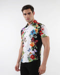 A vibrant short-sleeved floral border print stretch knit shirt with bold tropical flowers and butterflies on white
