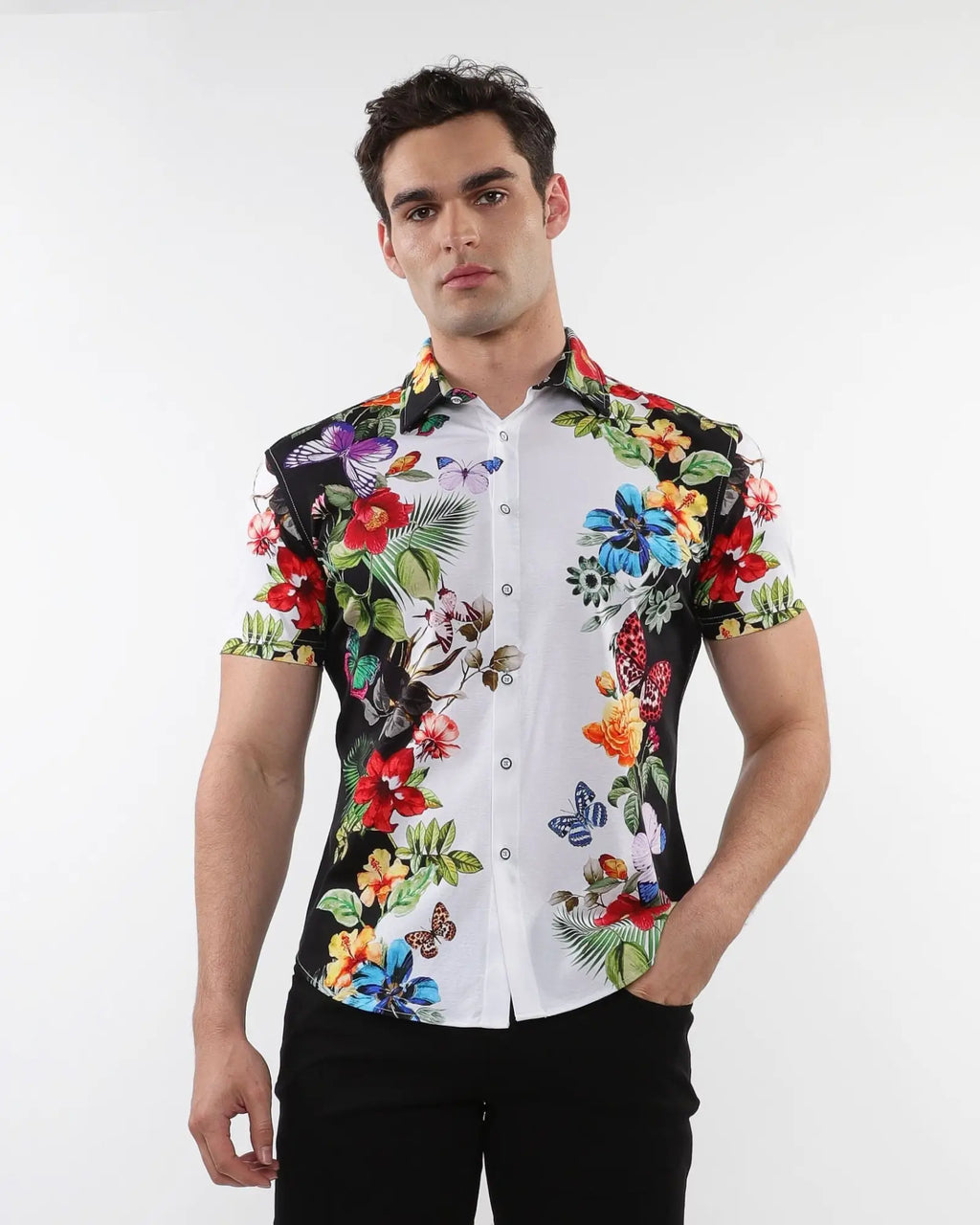 Floral border print stretch knit short-sleeved shirt with vibrant tropical floral and butterfly motifs on black and white